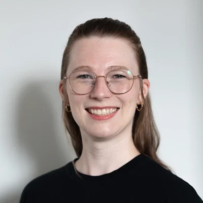 Chiropractic Calgary AB Sarah Moorhouse Smiling in a Professional Headshot